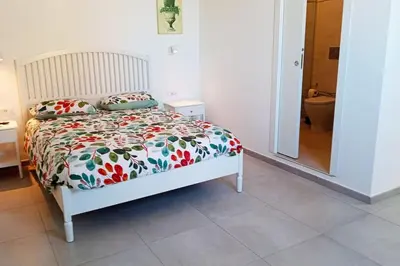Letto o letti in una camera di In centro storico panoramico con ampia terrazza!