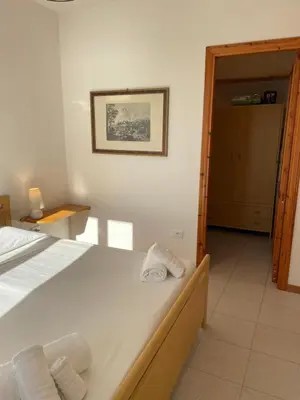 Letto o letti in una camera di Appartamento sul mare super panoramico