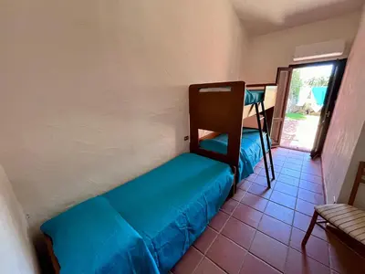 Letto o letti in una camera di Villetta Marino G By La Via Del Mare Viaggi e Vacanze