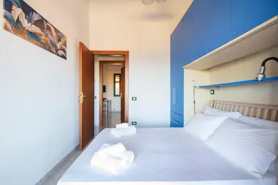 Letto o letti in una camera di Casa Arcobaleno
