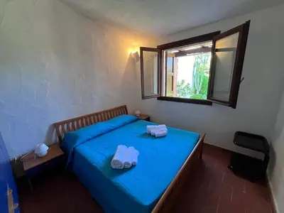 Letto o letti in una camera di Villetta Marino P By La Via Del Mare Viaggi e Vacanze