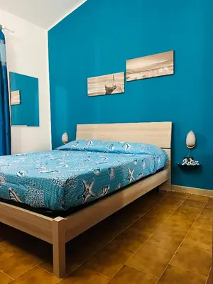 Letto o letti in una camera di Villa Rosa Marì