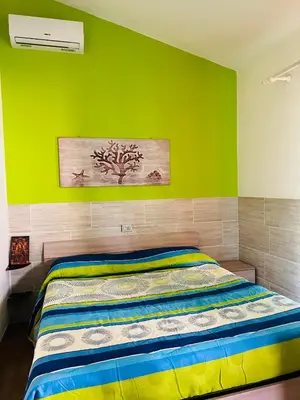 Letto o letti in una camera di Villa Rosa Marì