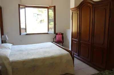 Letto o letti in una camera di Casa Rosi