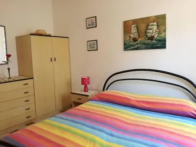 Letto o letti in una camera di Villetta relax 1