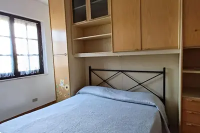 Letto o letti in una camera di Villetta relax 1