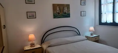 Letto o letti in una camera di Villetta relax 1