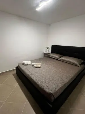 Letto o letti in una camera di Appartamento fronte Arbatax park resort