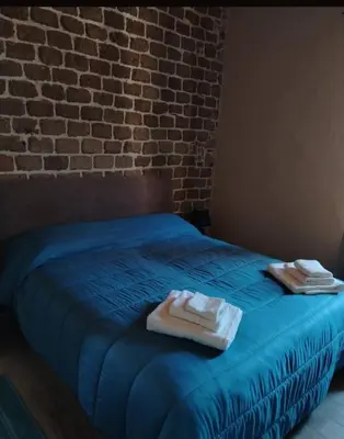 Letto o letti in una camera di Casa Gioconda Bed & Breakfast