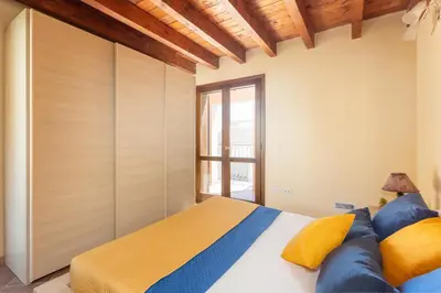 Letto o letti in una camera di Sant'Antioco - Spazioso appartamento al centro