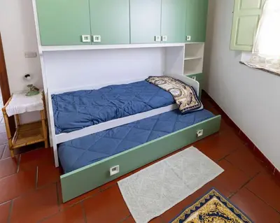 Letto o letti in una camera di Casa Nunzia
