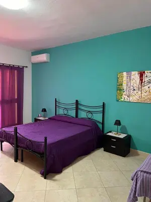 Letto o letti in una camera di Casa Azzurra