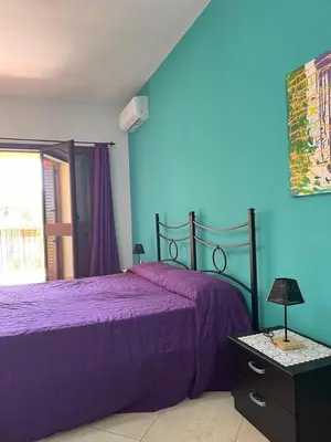 Letto o letti in una camera di Casa Azzurra
