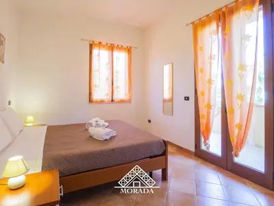 Letto o letti in una camera di Casa Sole e Luna - MORADA
