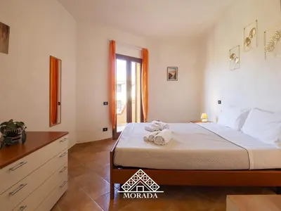Letto o letti in una camera di Casa Sole e Luna - MORADA
