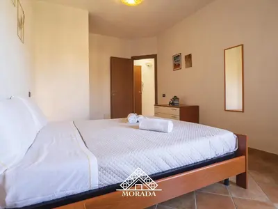 Letto o letti in una camera di Casa Sole e Luna - MORADA