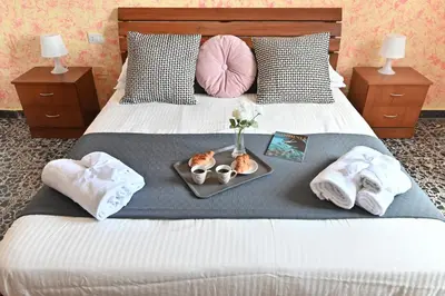 Letto o letti in una camera di IzzHome Central Room