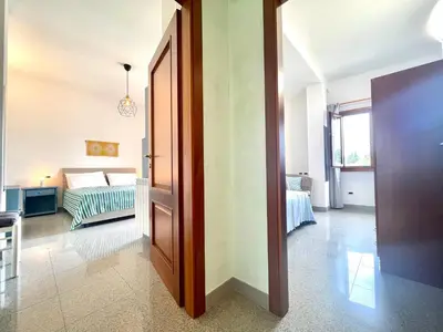 Letto o letti in una camera di Blue Zone Mimi Apartments