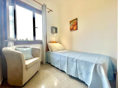 Letto o letti in una camera di Blue Zone Mimi Apartments