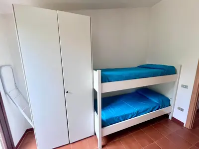 Letto o letti in una camera di Villetta Vele 2 By La Via Del Mare Viaggi e Vacanze