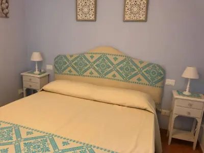 Letto o letti in una camera di Casa CANT Villasimius