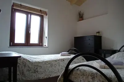 Letto o letti in una camera di Casa Torre Salinas at Casa Sardinia