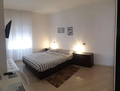 Letto o letti in una camera di Machiavelli House - Intero appartamento Cagliari