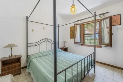 Letto o letti in una camera di a casa di nonna Cami