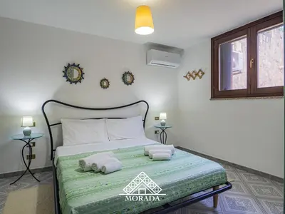 Letto o letti in una camera di Casa Roccia - MORADA