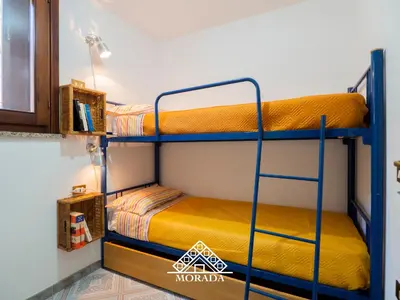 Letto o letti in una camera di Casa Roccia - MORADA