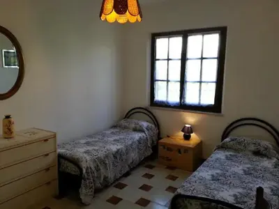 Letto o letti in una camera di Villetta relax 2