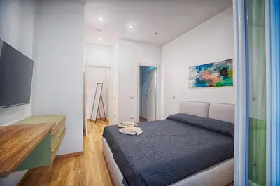 Letto o letti in una camera di 5 Minuti dalla Spiaggia - La Casa di Kiki