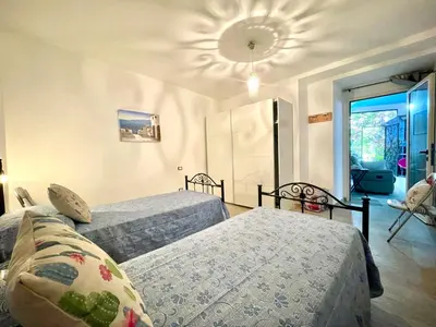 Letto o letti in una camera di La Corte Azzurra
