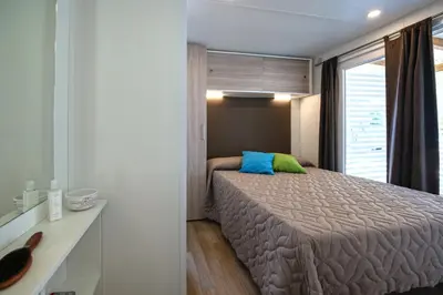 Letto o letti in una camera di Camping Village Orri
