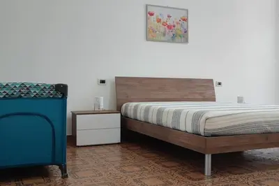 Letto o letti in una camera di Casa con giardino