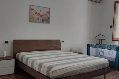 Letto o letti in una camera di Casa con giardino