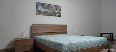 Letto o letti in una camera di Casa con giardino