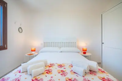 Letto o letti in una camera di Casa Paradiso Vista Costa Rei
