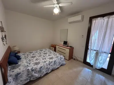 Letto o letti in una camera di Villa Angy a 7 minuti dal mare, aria condizionata