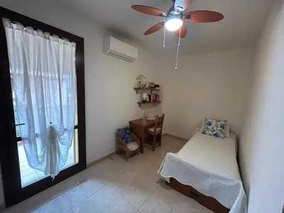 Letto o letti in una camera di Villa Angy a 7 minuti dal mare, aria condizionata