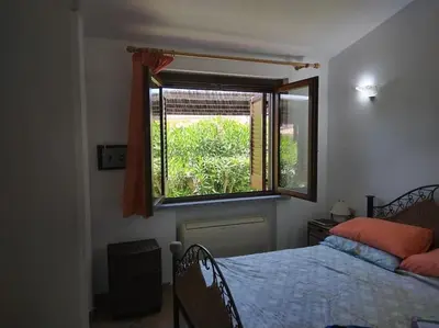 Letto o letti in una camera di Villa Malugi Oasi Esclusiva a Costa Rei