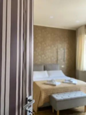 Letto o letti in una camera di Le Due Torri ROOMS