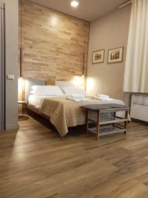 Letto o letti in una camera di Le Due Torri ROOMS
