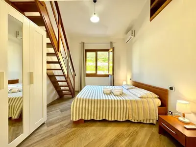 Letto o letti in una camera di Cronta Apartments