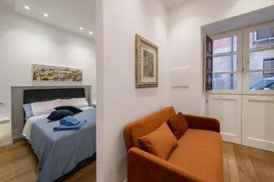 Letto o letti in una camera di Suite & Comfort Palazzo Sanna Cao