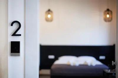 Letto o letti in una camera di Poettos heART - Rooms