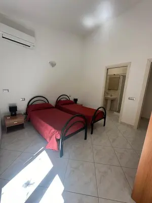 Letto o letti in una camera di Sole&Luna