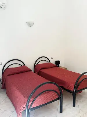 Letto o letti in una camera di Sole&Luna