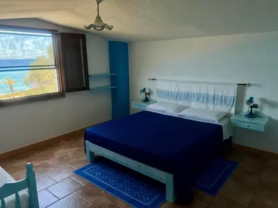 Letto o letti in una camera di La PAVONCELLA 2