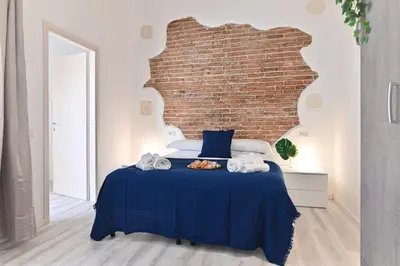 Letto o letti in una camera di IzzHome The Breeze